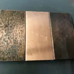 Three rectangular metal samples showing hammered, brushed, and dark-patina copper finishes.