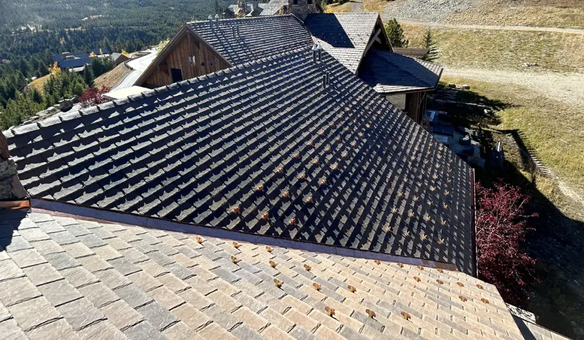 Dense natural slate laid in courses with flat faces and sharp edges — the signs of hard S1-grade stone